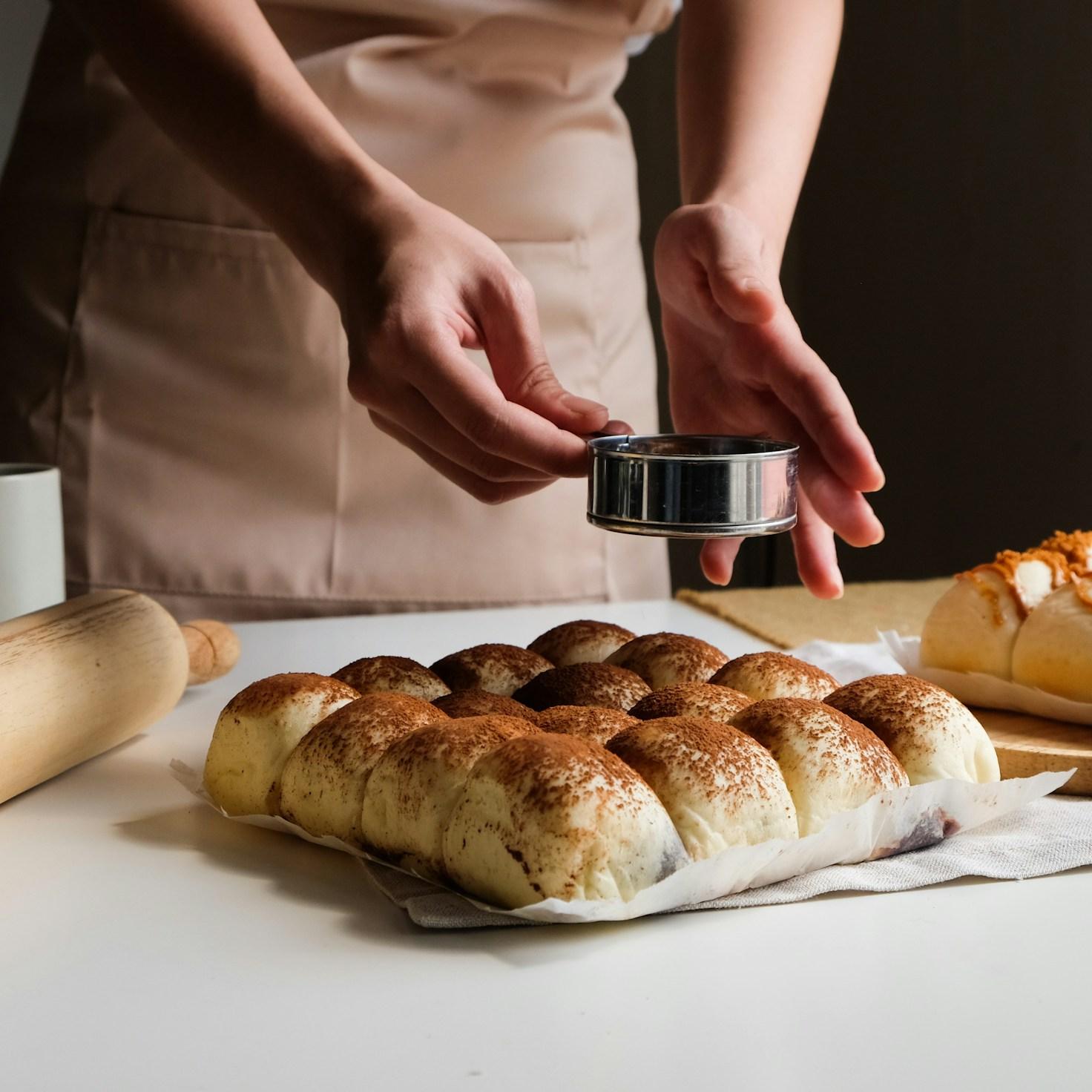 Members collaborating in a modern kitchen, exchanging recipes and cooking skills